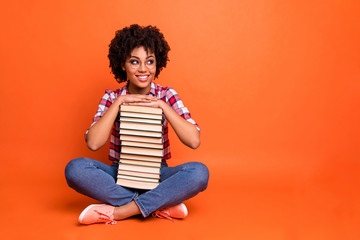 Full length photo pretty beautiful lady sit floor hold hands books glad back school dreamy wear specs casual checkered plaid shirt isolated orange background