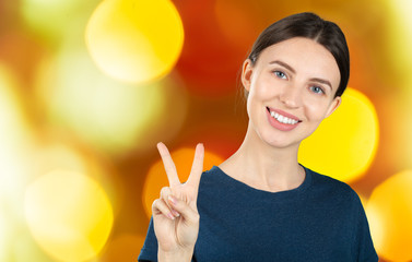 Canvas Print - Cheerful happy young beautiful girl looking at camera smiling