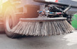 Close-up sweeper machine cleaning. Concept clean streets from debris