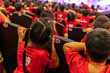 © Hanoi Photography - Children sitting on seats in the theater watching the performance