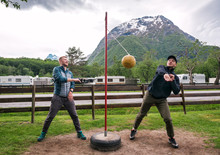 Two Friends Are Playing Tetherball Game