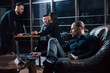 © standret - Prefer to done the job alone. Team of young business people works on their project at night time in the office