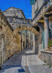 Wall Mural - Old medieval stone buildings in the city of Uzes, in the Gard Department of France