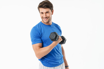 Wall Mural - Full length photo of handsome sportsman in shorts and t-shirt lifting weight while doing workout