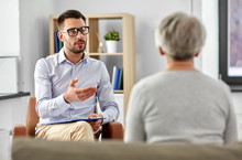 Geriatric Psychology, Mental Therapy And Old Age Concept - Psychologist Talking To Senior Woman Patient At Psychotherapy Session