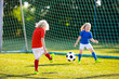 © famveldman - Kids play football. Child at soccer field.