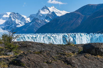 Amazing view of Perito Moreno glacier, blue ice burg glacier from peak of the mountain through the aqua blue lake in Los Glaciares National Park, Santa Cruz, Argentina, southern Patagonia ice field