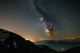 Fototapeta  - Milky way galaxy stars over the Alps, Mars and Jupiter planet, snowcapped mountain range, astro night sky stargazing