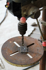 Electric drill in carpenter's work shop.