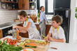 © lordn - Mother Teaching Kids to Cook and Help in the Kitchen. Healthy Food. Eat Healthier.