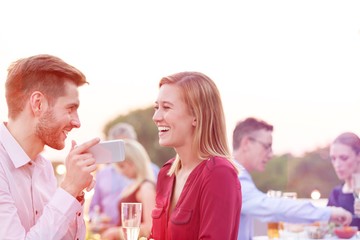 Wall Mural - Business people on a rooftop party.