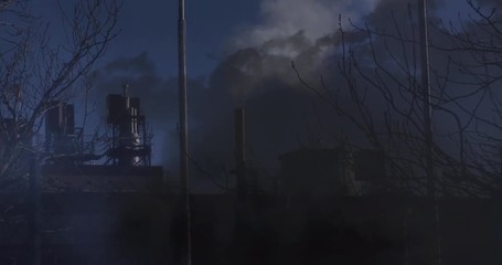 Wall Mural - factory with an industrial pipe and lightning in clouds