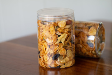 Wall Mural - Homemade organic healthy granola with dried fruits in bottles