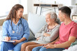 © Pixel-Shot - Caregiver visiting senior woman at home