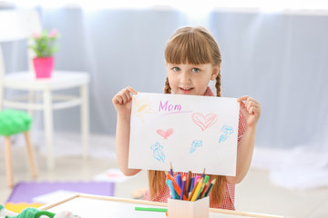 Sticker - Cute little girl drawing at home