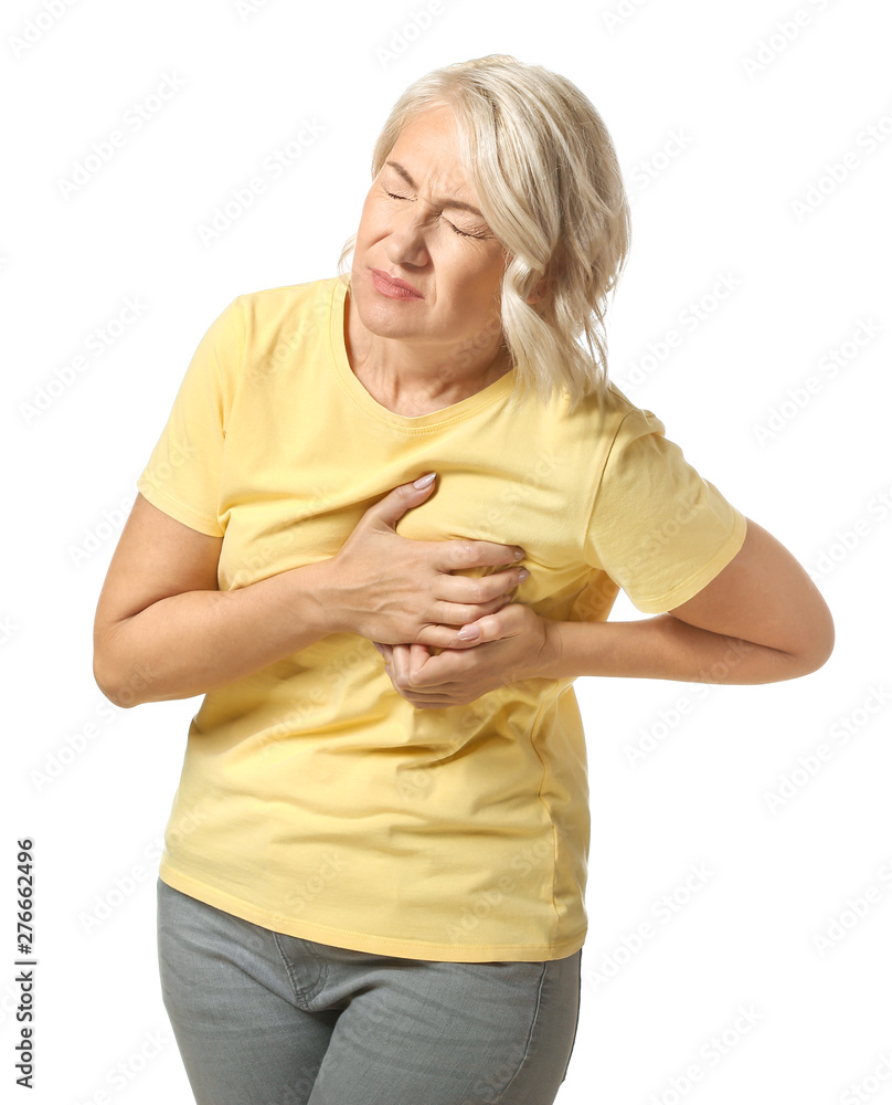 Mature woman suffering from heart attack on white background