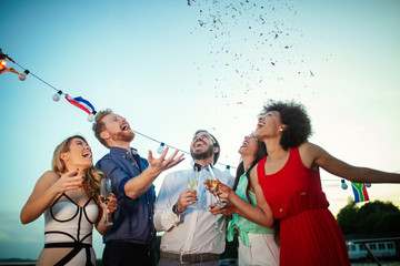 Group of friends having fun and celebrating group gathering