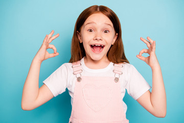 Close up photo of cute sweet kid make ok sign rejoice scream shout isolated blue background