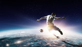 Fototapeta Sport - Soccer player in outer space in action. Mixed media