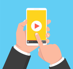 Wall Mural - hands holding smartphone and touching screen. video player on screen. vector illustration.