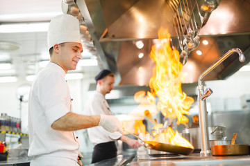 Wall Mural - cook cooks in a restaurant.