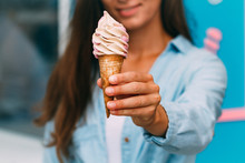 Woman Enjoys Her Sweet Ice Cream During A Summer Day