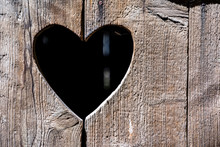 Heart Shape At An Old Wooden Door Of A Toilet