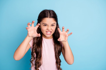 Wall Mural - Portrait of evil small naughty kid like wild animal show teeth have fun joy funky funny cute dressed fashionable clothing isolated on blue background