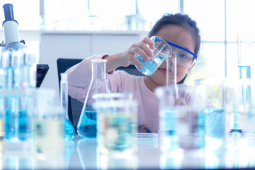 Wall Mural - asian children scientists analyzing study evaluating microscope. health care researchers doing some 