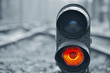© Grycaj - Traffic light shows red signal on railway. Red light