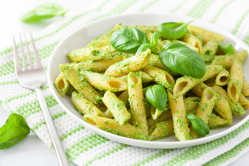 Wall Mural - penne pasta with spinach basil pesto sauce