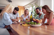 © ivanko80 - Group of young friends  having lunch