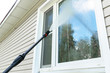 © Aleksei - Cleaning service washing building facade and window with pressure water. Cleaning dirty wall with high pressure water jet. Power washing the wall. Cleaning the facade of the house. Before and after