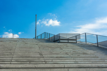 Canvas Print - Department stores, companies, buildings, subway, MRT, train shops, high-speed rail, common stairs in these public areas, with stainless steel handrails in the middle, ready to go upstairs.