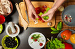 © frimufilms - Close-up overhead shot of woman hands preparing a healthy salad