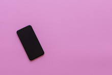 New Modern Black Phone On Pink Background, Flat Lay, Copy Space