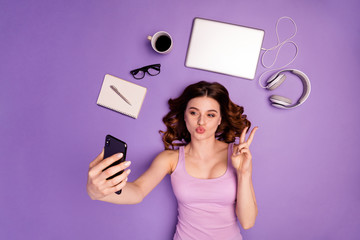 Poster - Portrait foxy teen device online browse internet send air kiss make v-sign tank-top singlet stylish pause hairstyle hipster trendy development work worker wavy curly isolated purple violet background