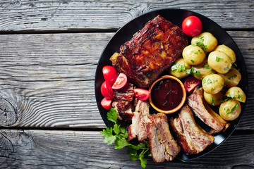 Poster - grilled pork ribs on a black plate