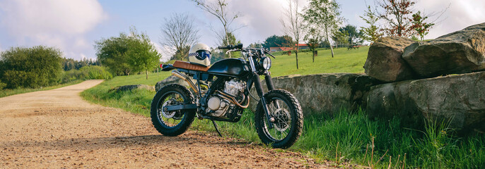 Beautiful vintage custom motorcycle parked on the side of the road