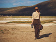 © Nejron Photo - Beautiful woman with binoculars at savanna in Kenya