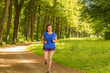 © Alejandro - Woman runs in the park in her training session