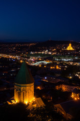 Poster - nighttime in tblisi city panorama with churches