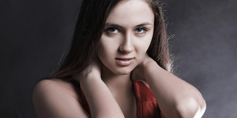 Wall Mural - fashionable young woman in red dress looking at copy space. iso