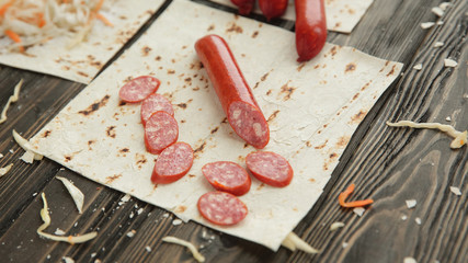 Wall Mural - ingredients for making burritos, isolated on dark wooden background