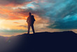 © Syda Productions - travel, tourism, hike and people concept - traveller with backpack standing on edge of hill over sunset background