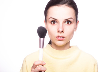 attractive girl does makeup, makeup brush