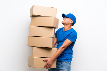 Delivery man over isolated white wall