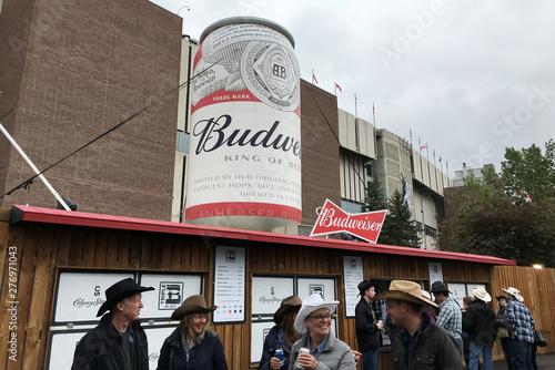 Visitors Walk In The Concessions Area Where Signs Are Posted