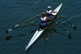 Two Male Rowers In A Double Racing Boat With Synchronous Oar Stroke