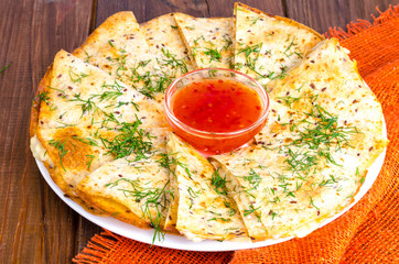 Wall Mural - Grilled pita, focaccia with cheese and herbs, sauce.